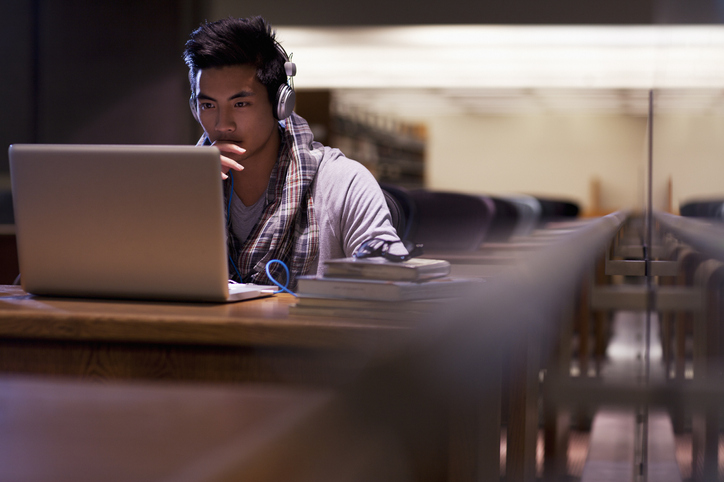 working on homework in the library